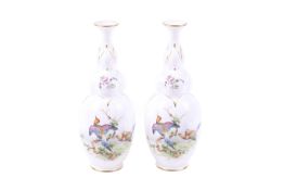 A pair of 1901 Royal Worcester shaped vases decorated with exotic birds.