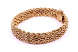 A 9ct gold bracelet. In the form of woven knot work, on a snap clasp, L20.3cm, 11.