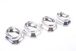 A set of four early George II silver canted-rectangular 'trencher' salts.
