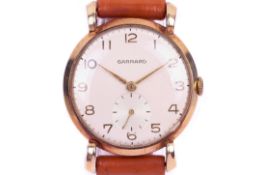 A vintage 9ct gold cased Garrard wrist watch.