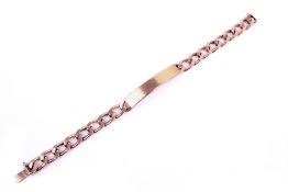A 9ct gold curb chain link safety bracelet. With a slide clasp, 30.