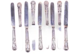 Nine matching Victorian silver Kings Pattern knives.