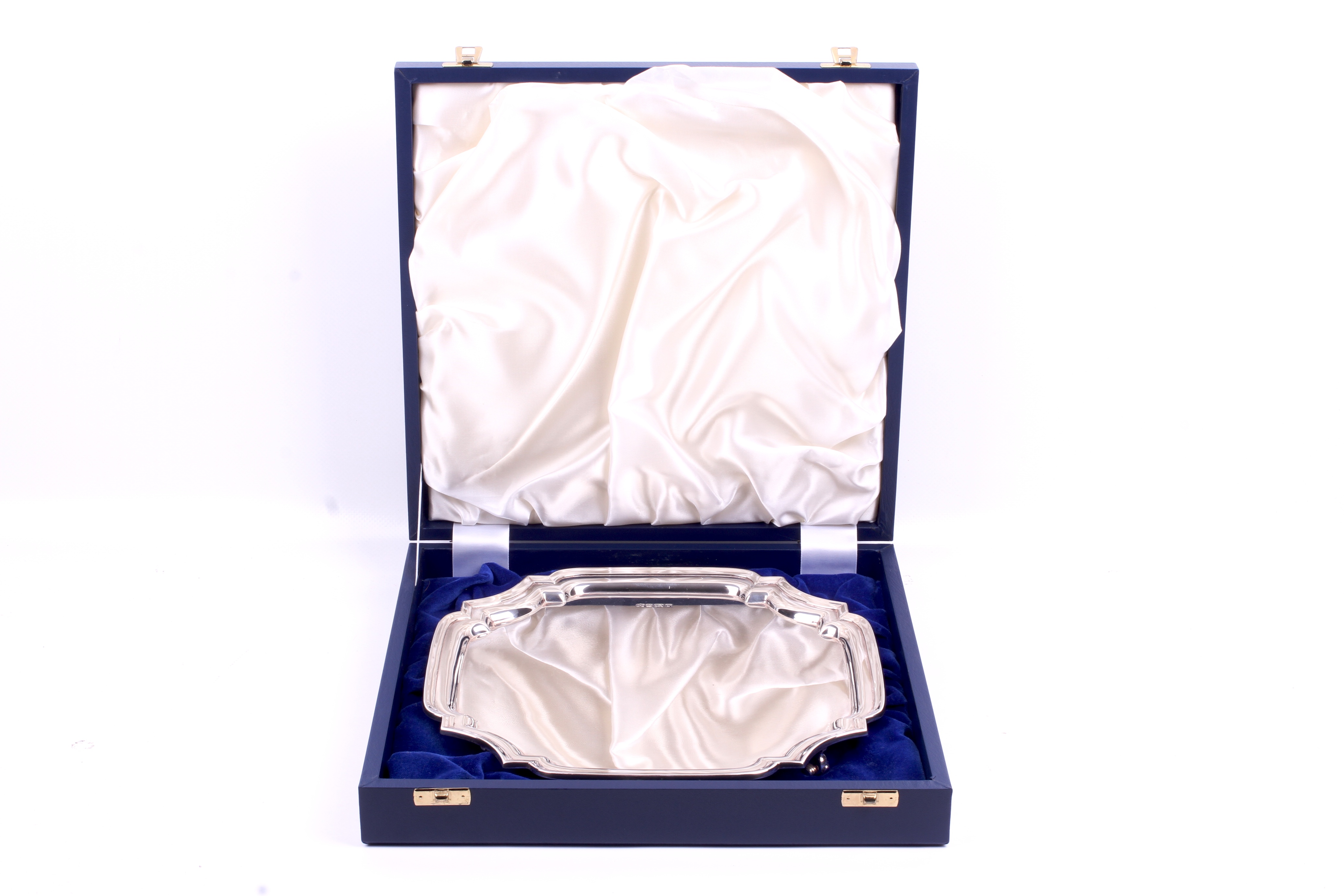 A silver quatrefoil footed tray. With stepped rim, raised on four short scroll feet. - Image 3 of 3