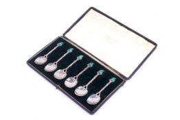 A set of six Art Nouveau enamelled silver coffee spoons.