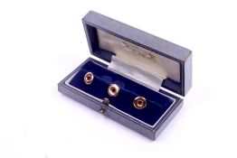 A set of three 9ct gold dress studs. Diameter 10mm, in a fitted Gieves case, 1.