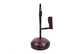 A wrought iron rush light holder or nip.