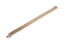 A yellow metal brick link panel bracelet.