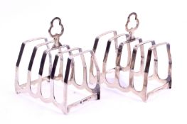 A pair of George VI silver toast racks.