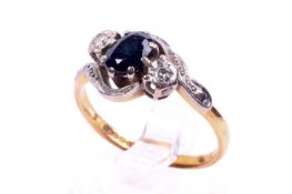 An 18ct gold sapphire and diamond dress ring. Set with one oval cut sapphire of 0.
