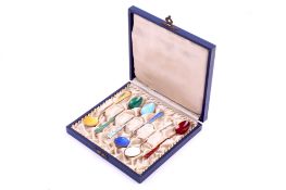 A set of six Danish silver and enamel spoons.