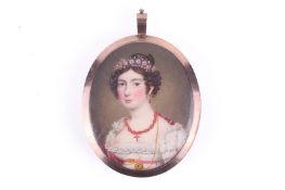 An early 19th century oval miniature painting on ivory of a young lady.