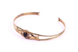 A 9ct yellow gold Claddagh style bangle.