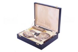 A silver backed dressing table set.