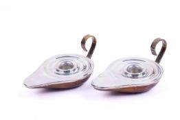 A pair of silver and gilt metal candlestick holders.