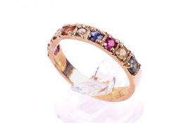 A yellow metal dress ring.