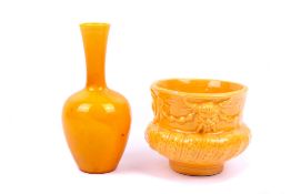 An early 20th century yellow vase and a moulded vessel, Burmantofts.