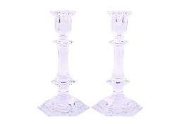 A pair of Baccarat hexagonal cut glass candlesticks.