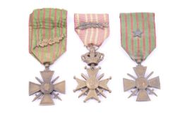 Two French medal Croix de Guerre and a WWII Belgium cross medal.