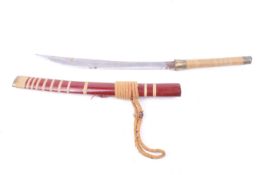 A 20th century Mandau sword and scabbard.