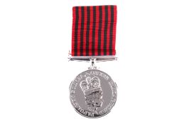A Papua New Guinea Civil Servant Long Service Medal. Marked 381, with red and black ribbon.