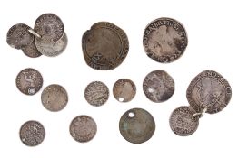 A small group of old silver coins. Including Charles I shilling and two sixpences etc.