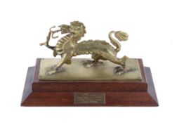 A brass dragon presentation piece.