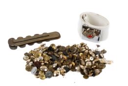 A collection of World War and later military buttons and other items.