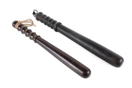 Two hardwood truncheons. Both with ribbed handle, one polished. Longest L43cm.