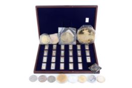 A collection of 23 gilt and enamel ingots in a fitted box.