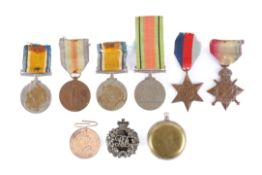 A WWI compass and a group of medals.