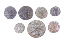 Seven possibly ancient Greek bronze coins.