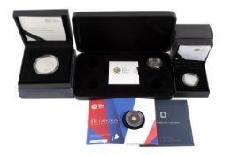 A group of four modern coins. Including 2014 50p gold coin weight 0.8gms of .