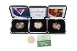 A collection of four assorted proof coins.