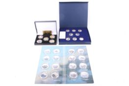 A collection of three sets of gold plated and enamelled medallions.