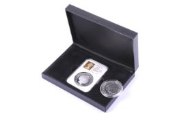Two silver coins. Including 2014 silver proof £5 coin and 2015 Britannia £2 coin.
