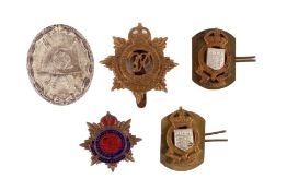 Five assorted WWII and later badges.