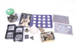 A collection of world coins, Hindu good luck charms and a few metal detecting finds.