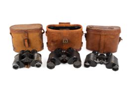 Three pairs of World War period binoculars.
