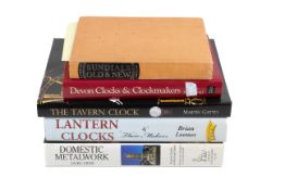 A collection of assorted clock related books.