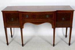 A Georgian style inlaid mahogany break front sideboard.