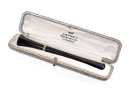 A vintage cigarette holder by Asprey of London presented in a fitted case.