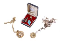 Five costume jewellery pendants.