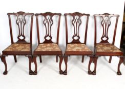 A set of four mahogany chairs.