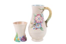 Two Clarice Cliff items. Including a Newport Pottery My Garden Series jug and a Wilkinson Ltd vase.