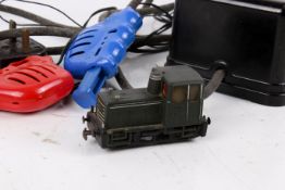 An assortment of 00 gauge Tri-ang railway vehicles and accessories.