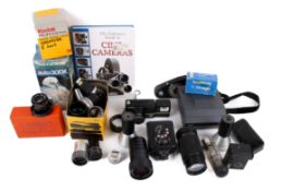 A mixed collection of cameras. Noting various lenses and Polaroid camera etc.