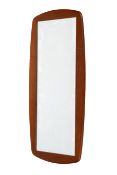 A mid-century teak framed wall mirror. Of rectangular form with rounded corners to the frame.