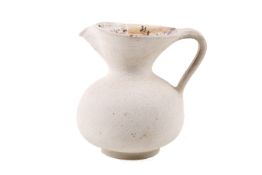 Waistel Cooper (1921 - 2003) studio pottery textured jug. Signature to base.