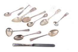 A small group of Georgian and later silver teaspoons and other cutlery.