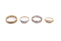 Four vintage stone set rings.